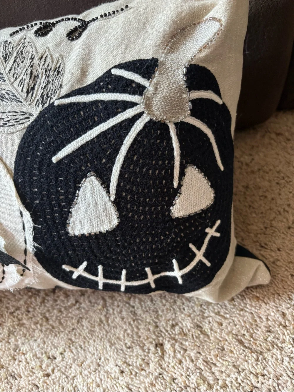 Appliquéd and sewn sparkle pumpkin pillow.